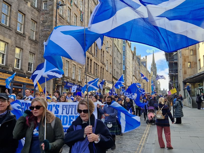 The Believe in Scotland march began at Parliament Square and proceeded down the Royal Mile, Saltires flying in the wind.