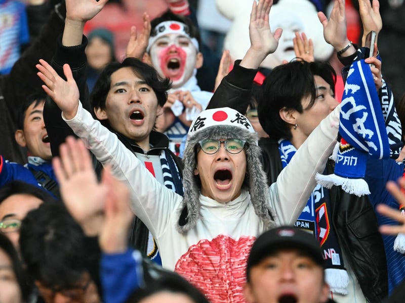 Japan fans cheer on their team.
