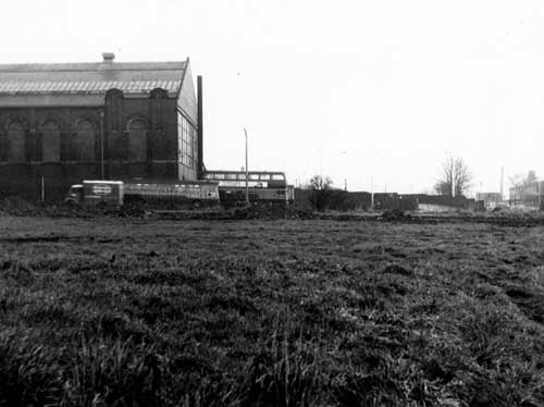 Looking east across Henconner Lane at Bramley Bus Depot in December 1968. Two buses and a van are visible.