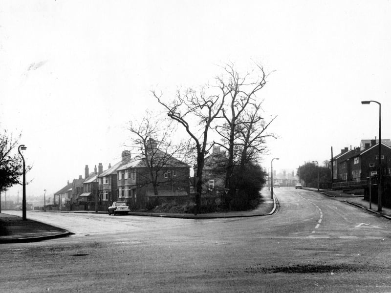 Looking east from Henconner Lane at the junction with Green Hill Mount, left, and Green Hill Road, right. Cars are parked on the road outside semi-detached houses. Pictured in November 1968.