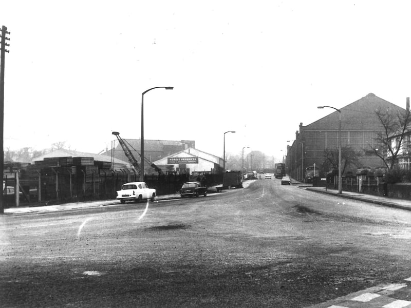 Looking north-west along Henconner Lane from its junction with Green Hill Road in November 1968. On the right Bramley Bus Station can be seen, with buses parked outside. On the left is Forest Products (timber merchants). This was formerly the Clifton Cinema which closed on Saturday, June 17, 1961.