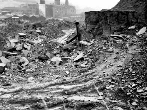 Looking east along Park Spring Quarry, Hough End, towards mill in background. A power shovel can be seen in the centre of the photo from December 1968.