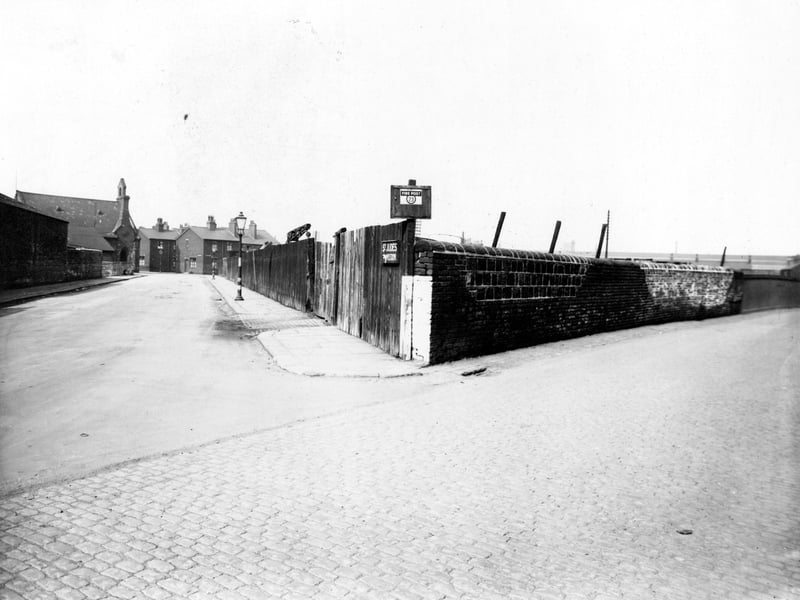 Cross Myrtle on the corner with Leathley Road in April 1947. Signs for St. Judes Mission and Fire Post. Crane in yard in background. Air raid wardens huts can be seen on the left before the church.