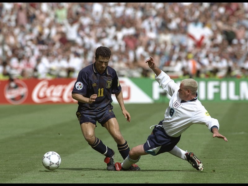 One of the most memorable tournaments in history, Euro 1996 came with its fair share of heartbreak, but this tartan number has been remake as a retro kit in recent years for a reason. A proper, good, old fashioned navy Scotland top with yellow trim. Lovely stuff.