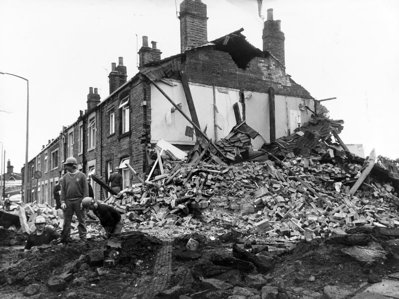 September 1984 and gasmen sift through the rubble of a house on Wakefield Road in an attempt to find the cause of the tragedy.