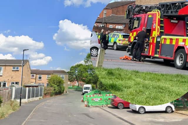 A street in the Waterthorpe area of Sheffield is closed after a wanted man climbed onto a roof and began throwing tiles at police.