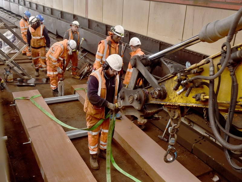 Engineers work to put the wheel timbers in place.