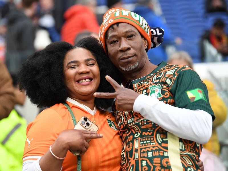 Ivory Coast fans pose for a picture ahead of the friendly.