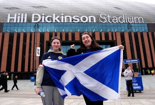 Two Scotland fans get ready for the game against Ivory Coast in Liverpool