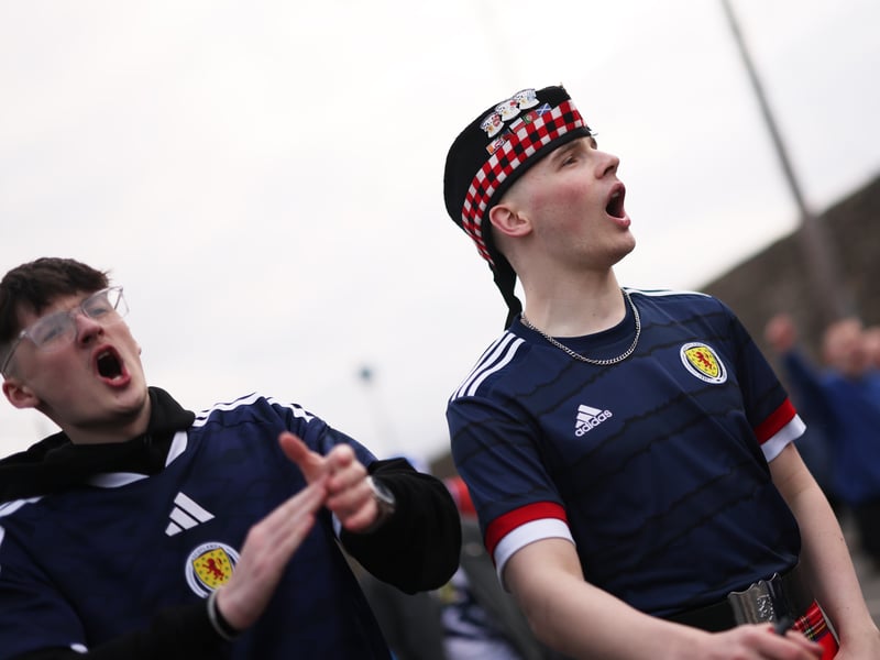 Scotland fans make their way to the Hill Dickinson Stadium.