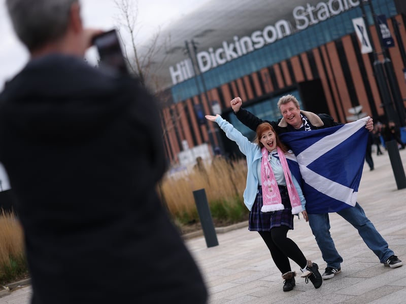 Scotland fans pose for a photo outside the stadium prior to the game against Ivory Coast.