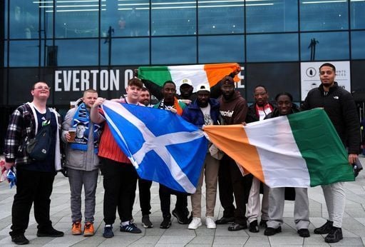 Scotland and Ivory Coast fans pose for a photo ahead of the match at Hill Dickinson Stadium.