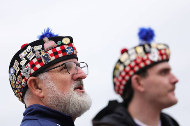 Scotland fans look on outside the stadium prior to the game vs Ivory Coast.