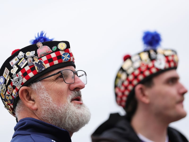 Scotland fans look on outside the stadium prior to the game vs Ivory Coast.