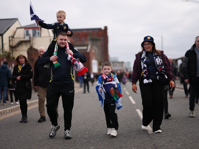 A family of Scotland fans head to game against Ivory Coast at the Hill Dickinson Stadium.