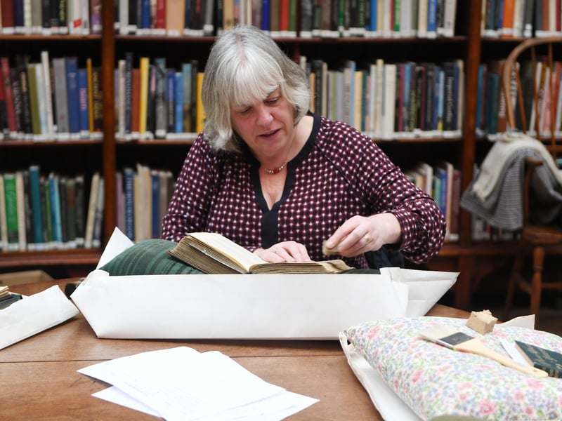 Dedicated volunteers clean the books at the Leeds Library.