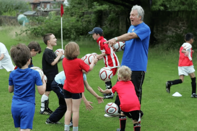 Ecclesall Rangers chairman Martin Windle during a coaching session with young footballers.
