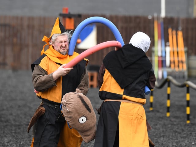 Fools entertain the crowds before the jousting tournament