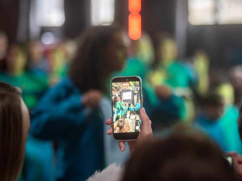 An audience member captures the scenes