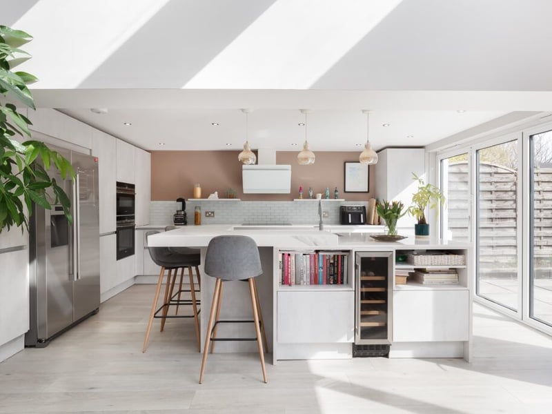 The fantastic contemporary open plan kitchen/family room with double bi-folding doors and WC apartment.