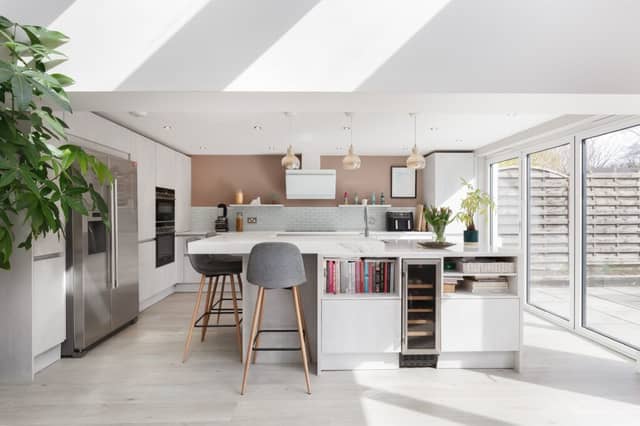 The fantastic contemporary open plan kitchen/family room with double bi-folding doors and WC apartment.