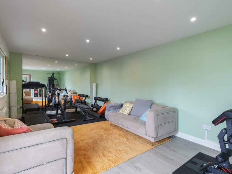 The summer house, currently being used as a gym with storage room and WC apartment. Also located in the rear garden is a outside utility room and a separate multipurpose home office/ storage space. 