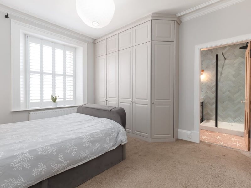Upstairs leads to the delightful master bedroom with built-in wardrobes and stylish en-suite bathroom.