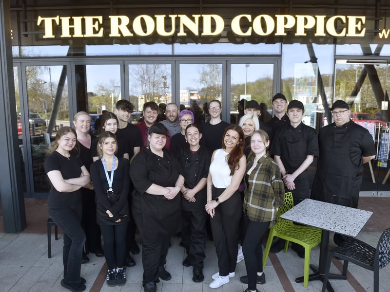 Lucy Dempsey (front, second from right), pub manager, with her team at The Round Coppice. 