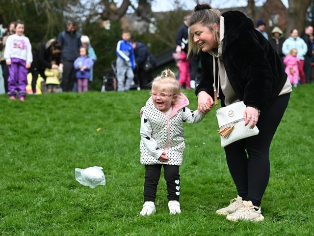 Another little one enjoying the egg rolling
