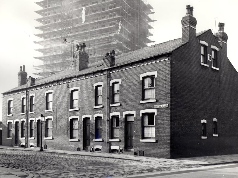 A view looking from Nineveh Road onto properties on the odd numbered side of Chelsea Street in November 1966. In the background, Meynell Heights housing development is under construction. These houses are back-to-backs and have been deemed unhealthy. After slum clearance, new houses were built on this site.