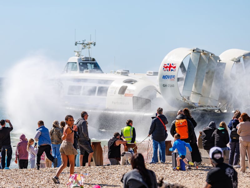 Onlookers watch the hovercraft take off in Southsea.