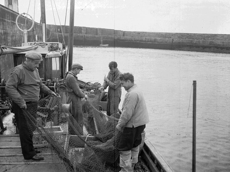 Skipper Jas Watson and his crew of the Minerva herring fishing boat at Anstruther in May 1956.