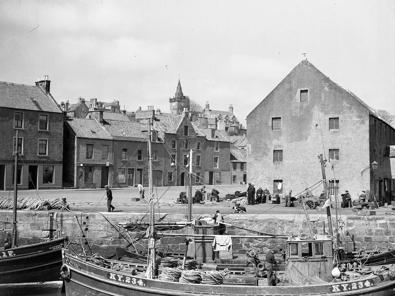 Fishing boats and fishermen in Pittenweem Harbour in May 1950.