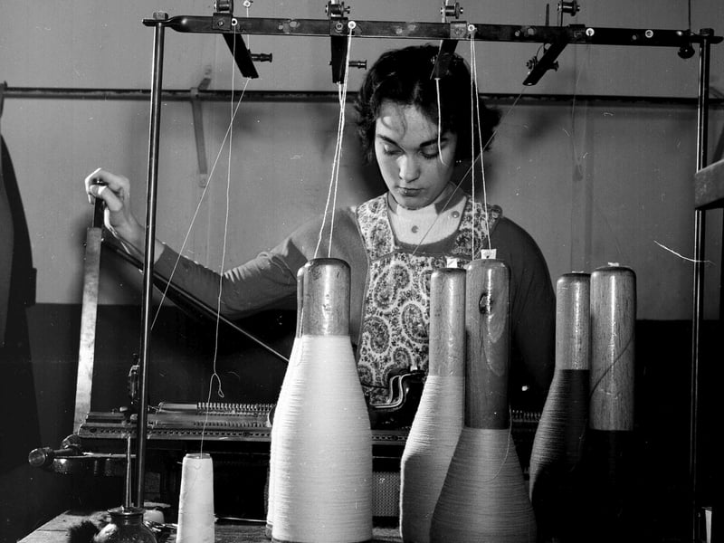 A woman operates a knitting machine making woollen garments for John Martin and Company in Anstruther in April 1960.