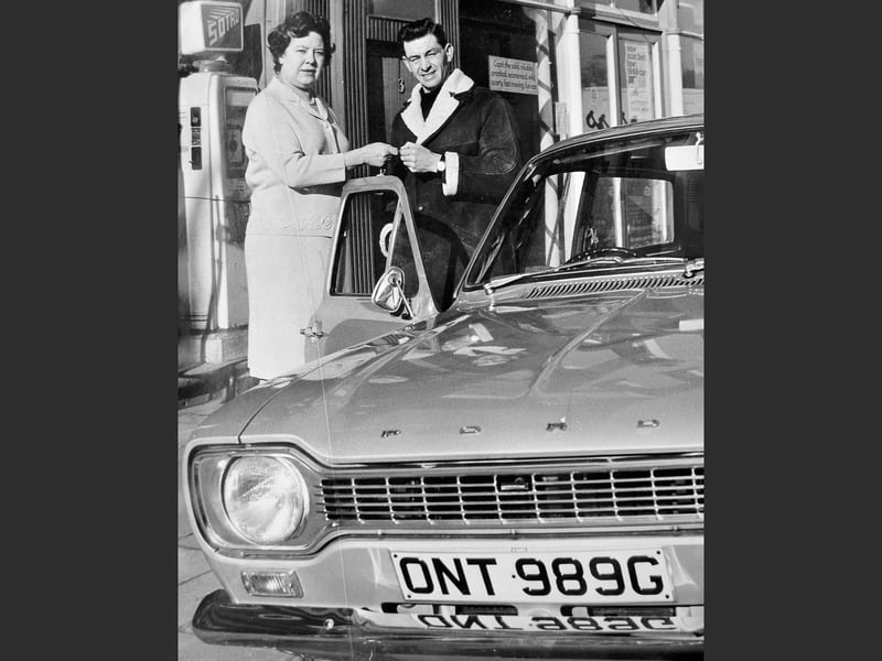This picture from March 14, 1969, shows Olympic gold medallist Staff Sergeant Ben Jones collecting the keys to a new car, a gift from his father in recognition of his success at the 1968 Mexico Olympics, where he was part of the British equestrian team. The original caption notes that the keys were presented by Miss P Warrender of Hogben’s, Newport.