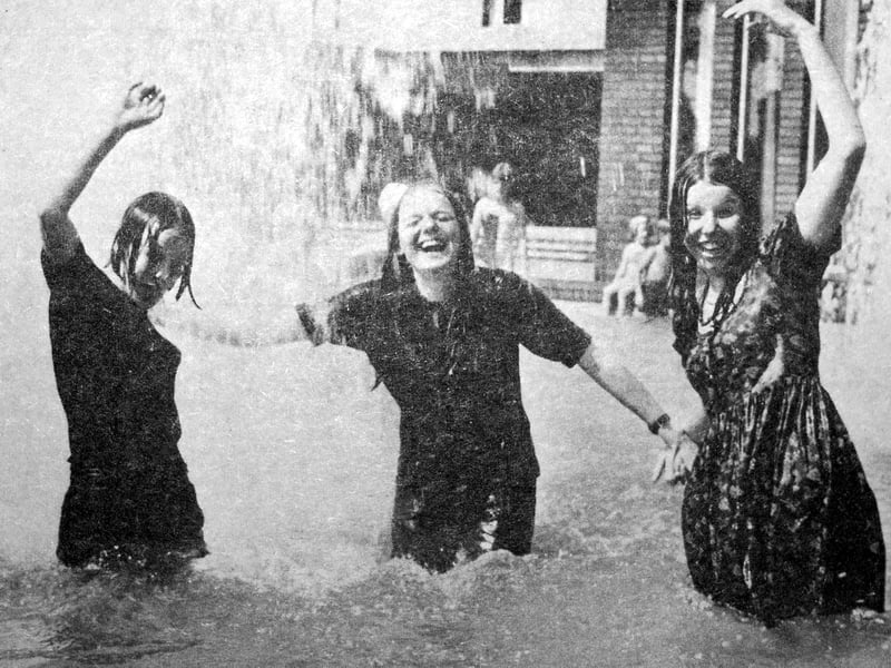 This picture from July 24, 1969, captures a light-hearted summer scene at the Shirehall ornamental pool. As temperatures rose, three teenagers—Jo Showell, Denise Waddington and Bridget Cooper—found themselves drawn to the water after watching others take a swim. A diverted fountain suddenly drenched them, prompting the trio to jump in themselves before heading home soaking wet.