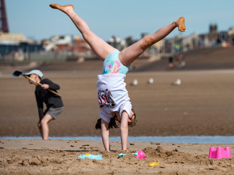 Youngsters play in the sand on Blackpool beach during the first mini-heatwave of 2026. Photo: Lucinda Herbert