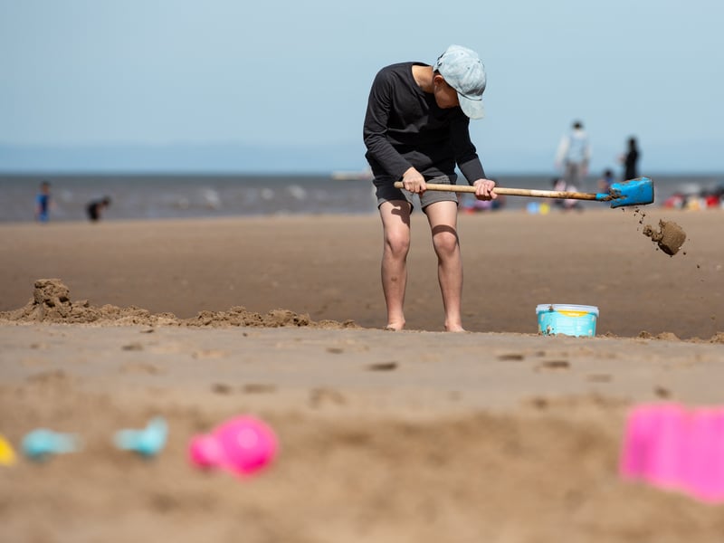 Kids build sandcastles and dig in the sand on Blackpool beach. Photo: Lucinda Herbert