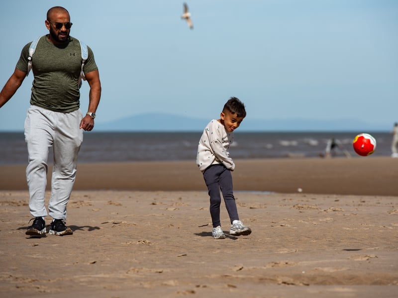 Families enjoy the sunshine on Blackpool beach. Photo: Lucinda Herbert
