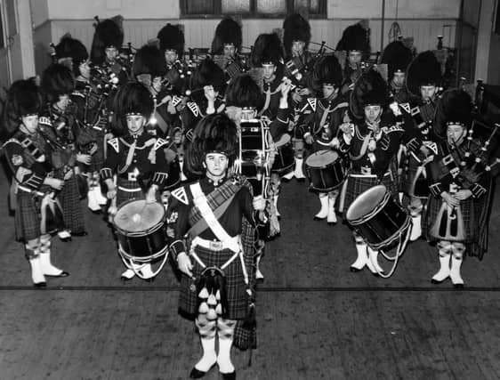 City of Leeds Pipe Band lines up at rehearsal in St. Edward's Church Hall in January 1967. At the head is Drum Major Sidney Taylor.