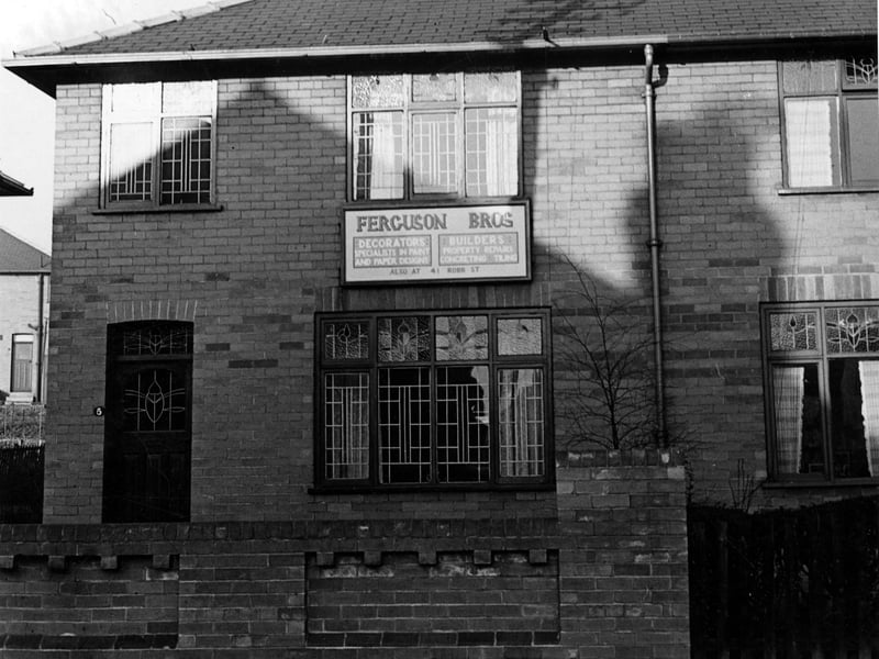 Wooler Drive in November 1945. Semi-detached house at number 5 Wooler Drive; also the premises of Ferguson Bros, decorators and builders. There is a large notice board advertising the firm between the ground floor and upper storey windows.