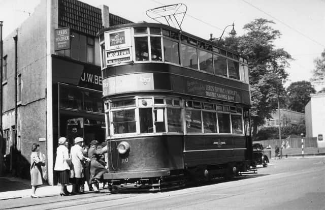 Chamberlain tram no.110, on route 2 to Moortown, stopping to pick up passengers on Harrogate Road in June 1951. To the left of the photo is no.51 Harrogate Road, which is home to J.W. Bennett radio and the Leeds and Holbeck Building Society, by the junction with Club Row.