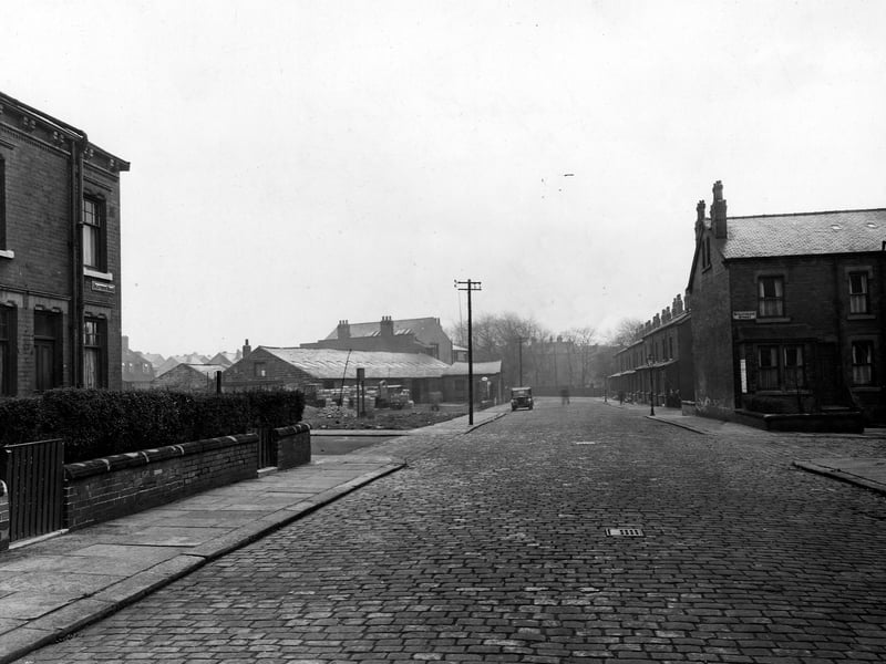 Looking south-east down Seaforth Road in November 1948. On the right is the junction with Strathmore Street. On the left is number 48 Seaforth Road, then the junction with Trafford Grove. Beyond is Harehills Garage.