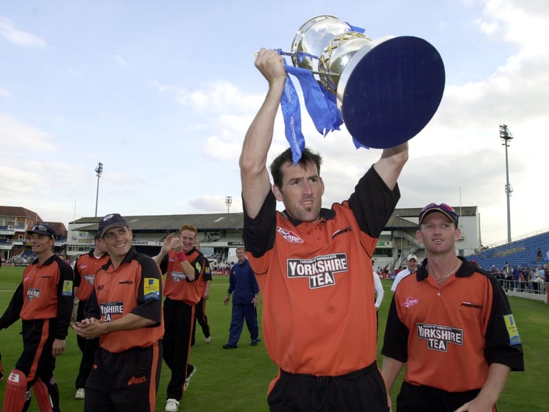 Yorkshire's Matthew Elliott shows of the C&G trophy to the fans in August 2002.
