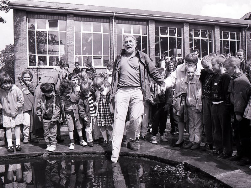 David Bellamy entertains children at Lydgate First School, Crosspool, Sheffield, as he drops by to open the new mini wildlife garden in June 1991