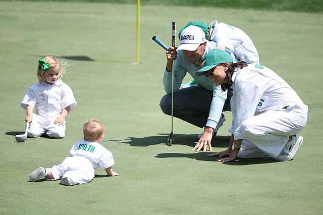 Jordan Spieth of the United States, wife Annie, son Sammy, daughter Sophie and son Sully on the ninth green.