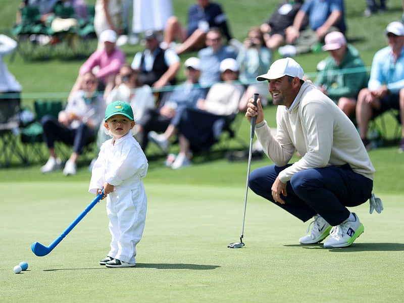 Scottie Scheffler of the United States smiles alongside son Bennett.