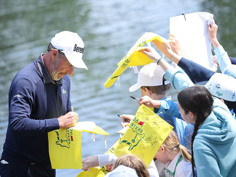 Jose Maria Olazabal of Spain signs his autograph for patrons.