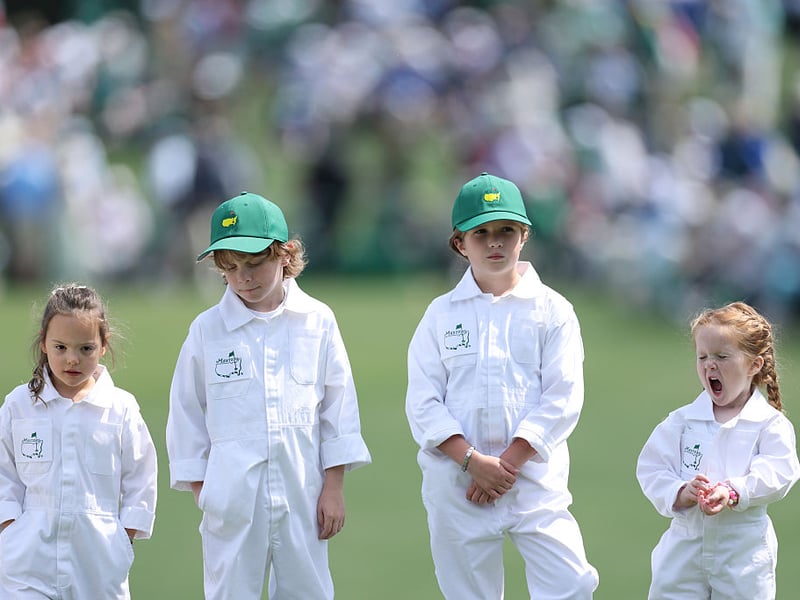 Poppy McIlroy, Franklin Fleetwood, Iris Lowry and Ivy Lowry are seen during the Par Three Contest.