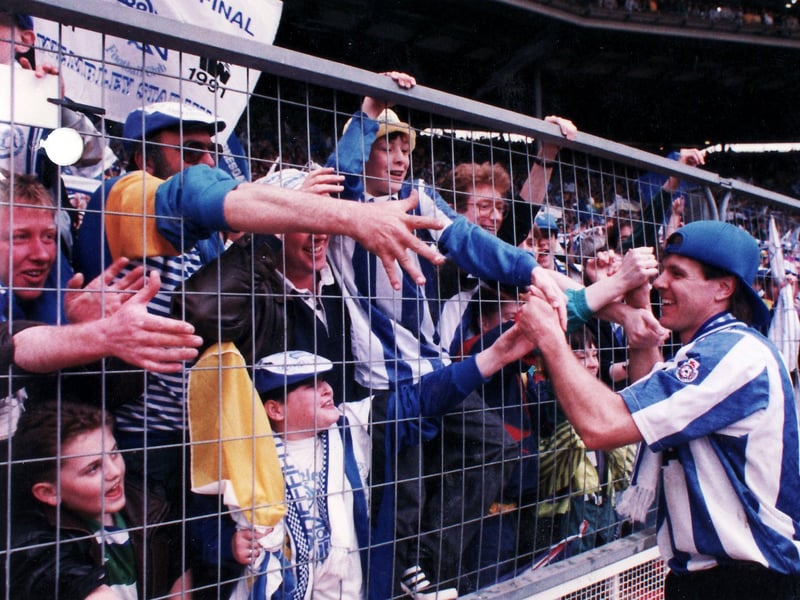 Sheffield Wednesday fans and players celebrate the club's 1-0 victory over Manchester United at Wembley in the Rumbelows League Cup Final in April 1991. Wednesday went on to win promotion at the end of the season 1990/91, making it a double celebration.